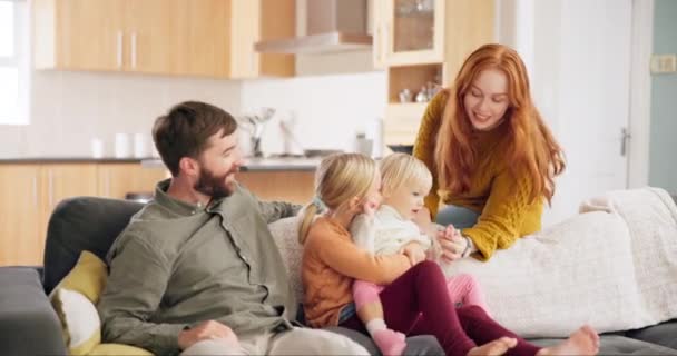 Happy, relax and care with family on sofa for love, bonding and support. Happiness, free time and affection with parents and children in living room at home for free time, lounge and positive. - Footage, Video