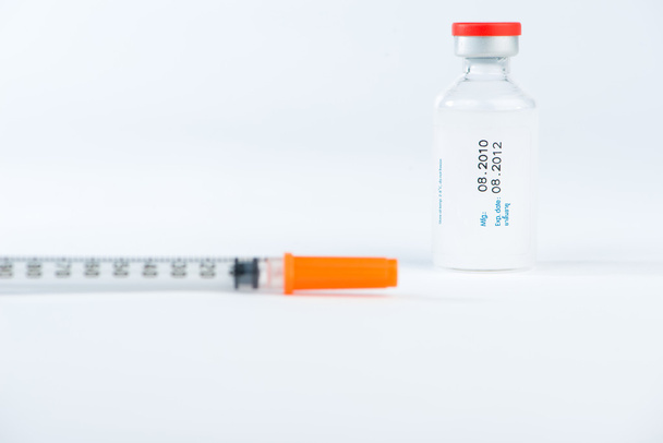 Injection vial and blur of injection syringe - Photo, Image