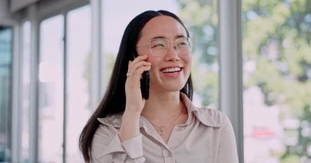Woman, phone call and communication, smile and talking with networking or casual chat while at the office. Asian female professional, happy and b2b with contact and news about career opportunity. - Footage, Video