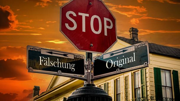 Egy kép egy táblával, ami két különböző irányba mutat németül. Az egyik irány az eredetire mutat, a másik a hamisításra.. - Fotó, kép