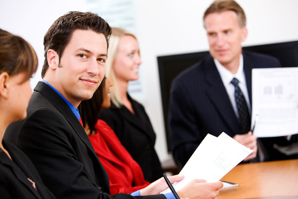 Business: Man In Meeting Looks At Camera - Photo, Image