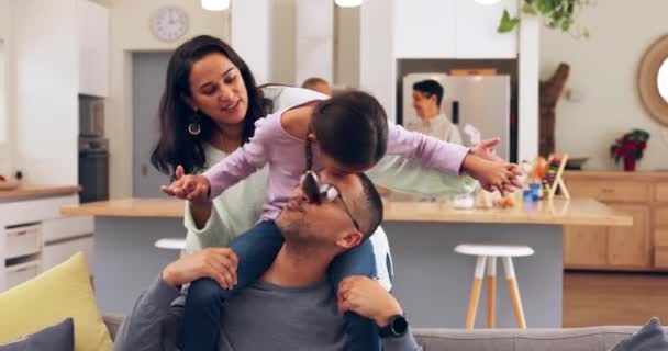 Airplane, kiss and family on a sofa playing, bond and relax at grandparents home together. Flying, love and girl child with mother and father for shoulder, game and piggyback fun in a living room. - Metraje, vídeo