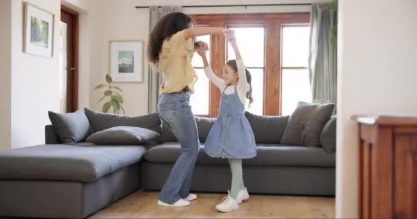 Dance, love and mother with daughter in home for bonding, quality time and loving relationship. Family, happy parents and mom with girl in living room for dancing, learning and teaching move together. - Footage, Video