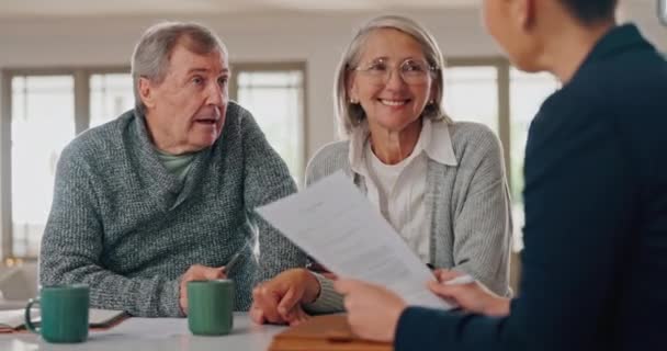 Elderly couple, documents and financial advisor in retirement, consultation or planning at home. Senior man or woman talking to finance consultant or agent with paperwork in budget plan or investment. - Footage, Video
