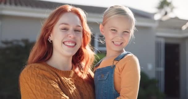 Face, smile and mother with girl in backyard of home, bonding and talking for fun communication. Happy, portrait and child with mama outdoor enjoying quality time together with care, love and family - Footage, Video