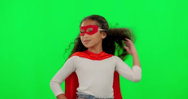 Female child, superhero and green screen with mask, hair flip and fight for justice in mock up. Young girl kid, power and portrait with confidence, superhero cape and stop crime in studio background. - Footage, Video