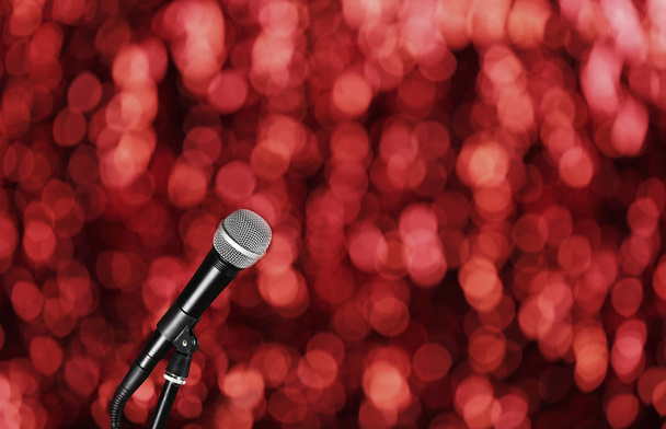 Microphone on bright red background - Fotó, kép