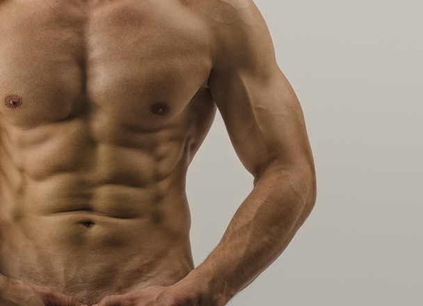 Close up on perfect abs. Strong bodybuilder with six pack, fit body - Φωτογραφία, εικόνα