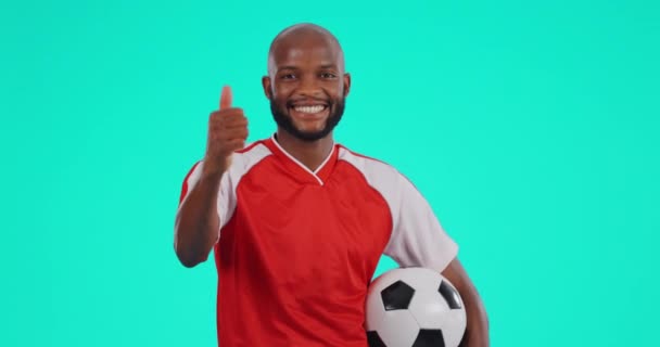 Black man, soccer and thumbs up on mockup for motivation or approval against a studio background. Portrait of African male person or sport player with like emoji or yes sign for game success or match. - Footage, Video