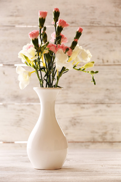 Beautiful spring flowers on wooden background - Foto, imagen