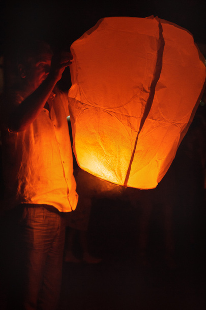 Man holds Burning celestial lamp - Photo, Image