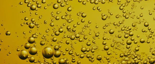 Golden Hyaluron bulles d'huile collagène sérum ou jaune bulles d'huile goutte texture fond. Gouttelettes transparentes liquides. Produit essentiel aux soins de la peau avec des dribs. Bulle de sirop de miel. Gouttelettes d'huile gros plan - Photo, image