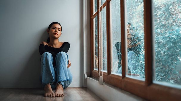 Depressed young Asian woman with mental health problem in mind need uttermost treatment from overthinking fatigue, disruptive thought, dissocial, anxiety and other mental health disorders . - Photo, Image