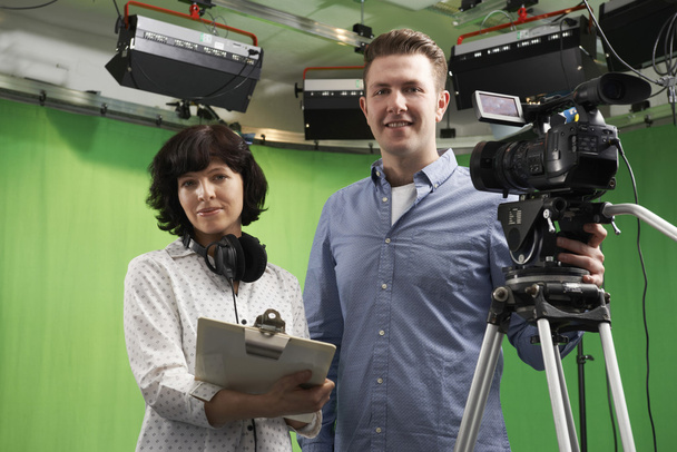Portrait Of Cameraman And Floor Manager In Television Studio - Foto, Imagem