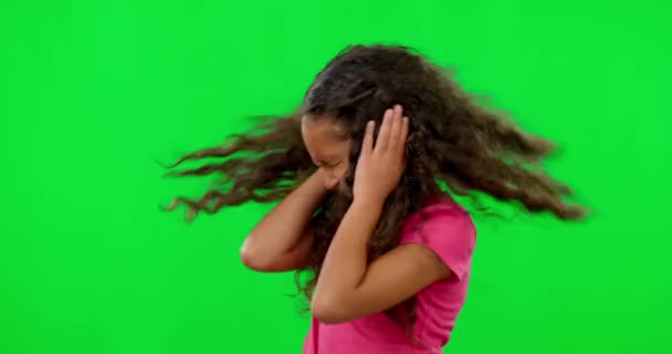 Noise, green screen and hands on ears of girl child in studio with autism, unhappy and frustrated. No, sign and autistic kid with body language for stop, loud and annoyed, problem or loud mistake. - Footage, Video