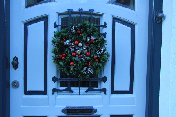 Classic christmas wreath with decorations on a door - Foto, Imagen