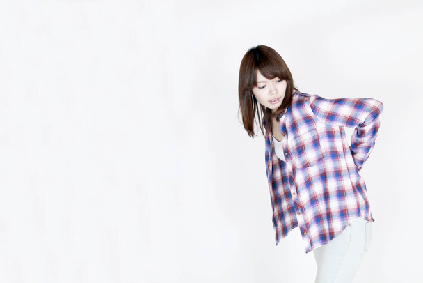 portrait of beautiful young asian woman in plaid shirt on white background - Φωτογραφία, εικόνα