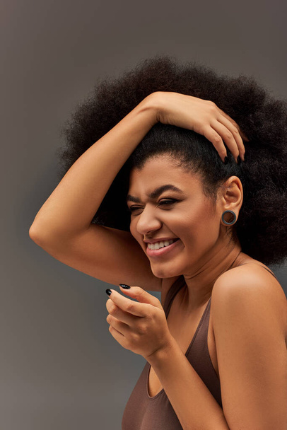 cheerful african american female model in pastel underwear smiling happily, fashion concept - Φωτογραφία, εικόνα