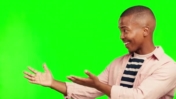 Black man, presentation and advertising on green screen, mockup space and communication on studio background. Happy male person, model show information and opportunity with marketing and ads. - Footage, Video