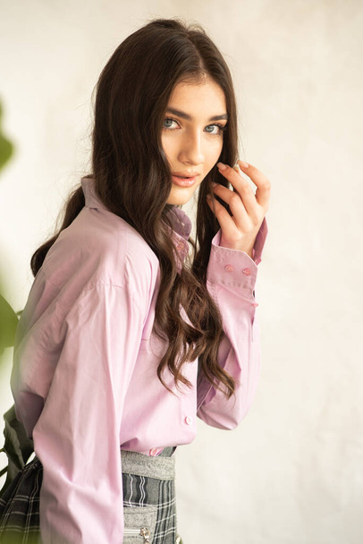 portrait of young beautiful brunette woman in spring clothes - Photo, Image