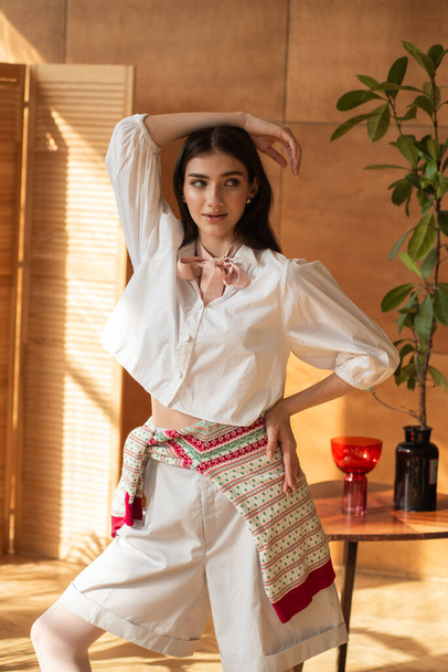 young woman in a red blouse and a white skirt with a white blouse - Photo, Image