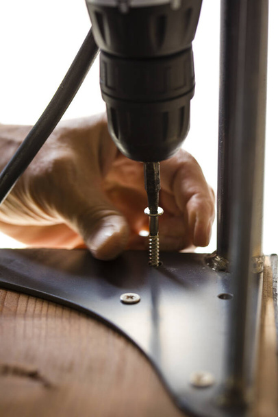 Close-up view of male carpenter working on table at industrial workshop - Φωτογραφία, εικόνα