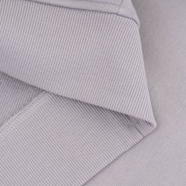 Bottom with elastic band of light gray sweatshirt close up - Photo, Image