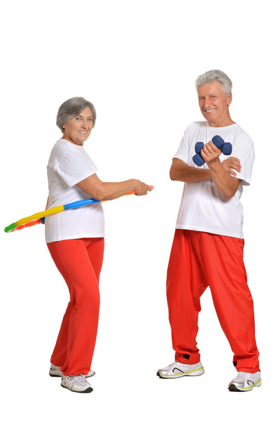 Elderly couple in a gym - Foto, afbeelding