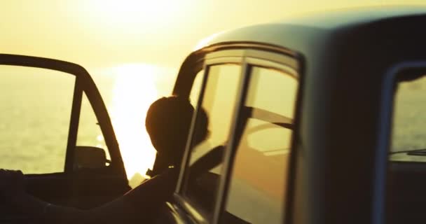 Woman, silhouette and sea sunset with car on road trip with motivation and achievement from travel. Drive, adventure freedom and female person back on holiday and vacation by the ocean with transport. - Footage, Video