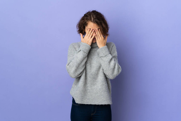 Young English woman isolated on purple background with tired and sick expression - Photo, Image