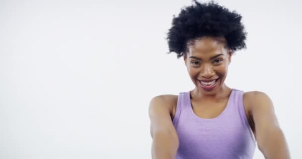 Woman, smile and pointing in portrait for workout, personal trainer and promotion for wellness. Black female model, training and invite in mockup, motivation and happy in studio by white background. - Footage, Video
