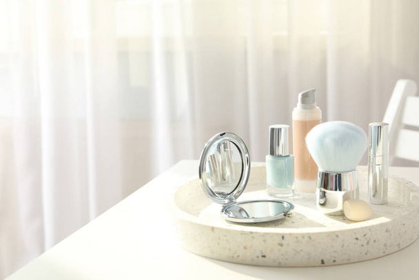 Cosmetics and accessories on a white table - Photo, Image