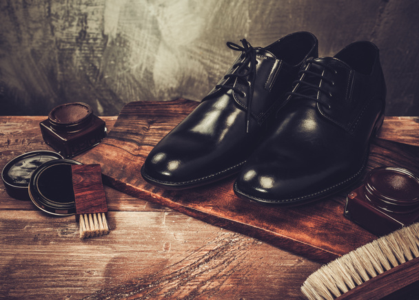 Shoe care accessories on a wooden table  - Φωτογραφία, εικόνα