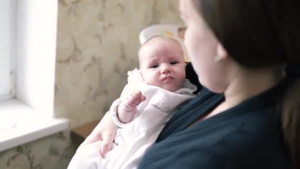 Revealing mother consoling crying newborn baby infant embracing good for transition - Materiał filmowy, wideo