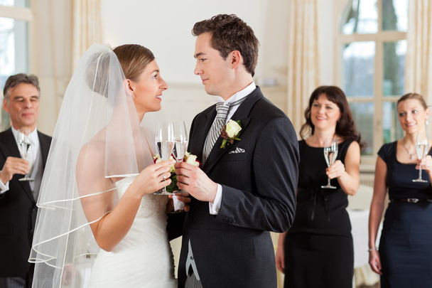 Bridal couple clinking glasses - Photo, Image