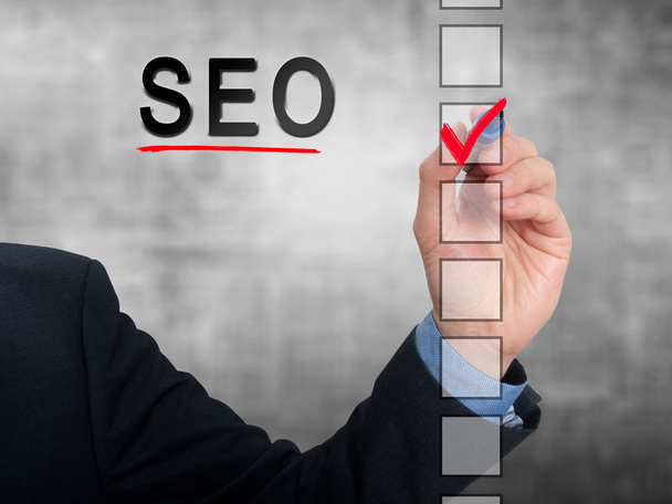 Businessman checking mark on SEO checklist marker. Checking SEO. Isolated on  background, Stock Photo - Foto, afbeelding