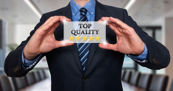 TOP Quality with five stars - Businessman with sign - Isolated on various background - Stock Photo - Foto, afbeelding