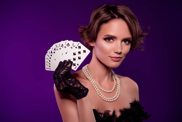 Photo of wealthy noble lady in night club playing poker on vintage event occasion over purple background. - Photo, Image