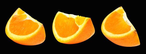 Orange piece isolated with clipping path no shadow in black background, healthy fruit - Photo, Image