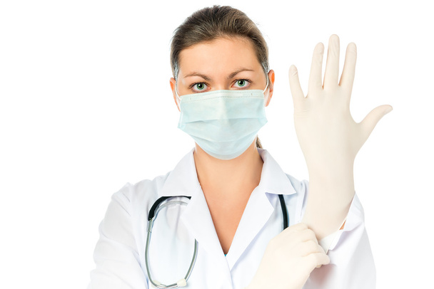woman surgeon preparing for surgery put on gloves - Zdjęcie, obraz