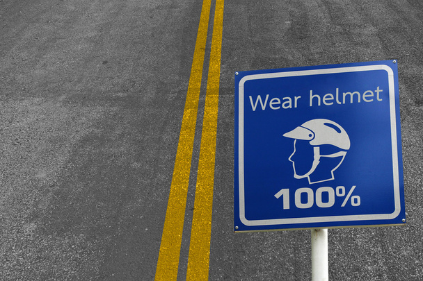 O sinal de zona de segurança de usar um capacete para a segurança na estrada
 - Foto, Imagem