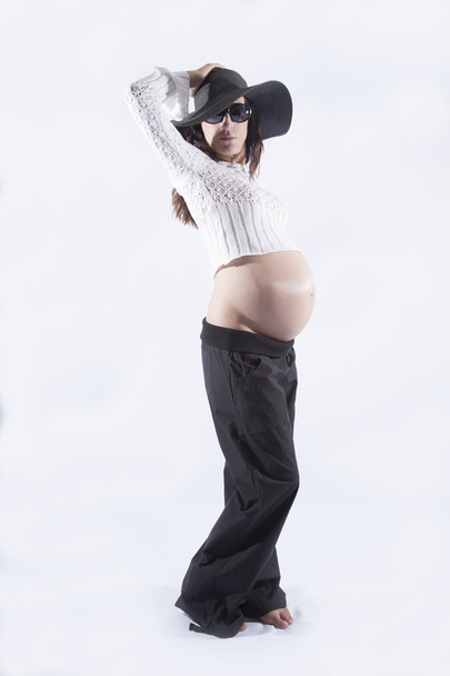 model pregnant woman black hat posing - Zdjęcie, obraz