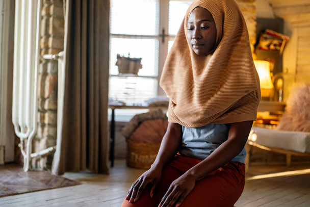 Young muslim black woman praying at home. People religion concept - Photo, Image