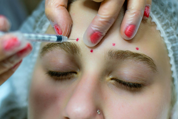 Beaty injection in forehead zone made in beaty clinic - Photo, Image