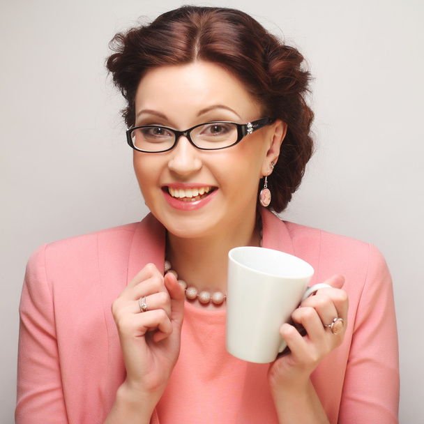 Young businesswoman having a coffee-break - Photo, Image