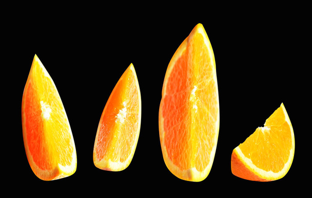 Orange pieces isolated with clipping path no shadow in black background, healthy fruit - Photo, Image