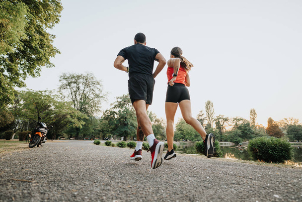 Active Couple Running in Park: Outdoor Workout for Wellness - Photo, Image
