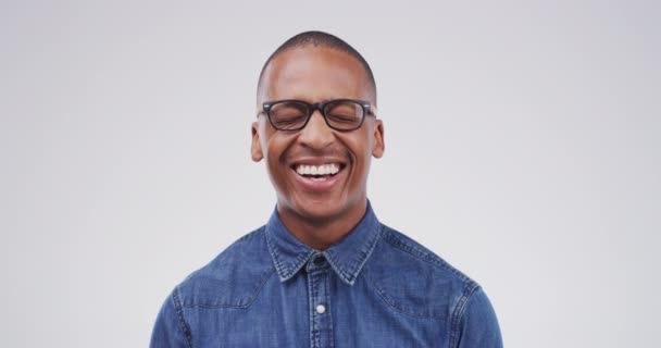 Black man, laughing and funny portrait in studio, white background or comedy mockup. Happy, smile and person with comic emoji, reaction or expression to meme humor, joke or announcement of news. - Footage, Video