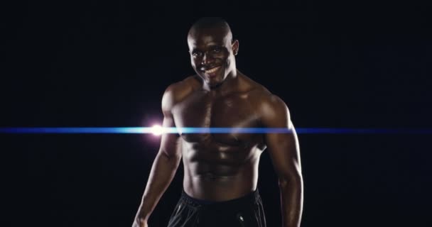 Face of athlete, studio or happy strong man with confidence for fitness or wellness on black background. Sports, smile or healthy African bodybuilder ready for workout, muscle training or exercise. - Footage, Video