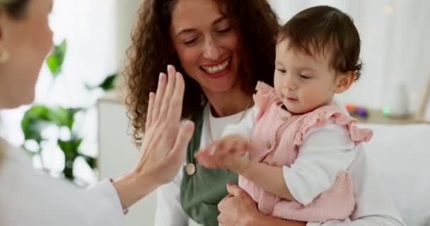 Mother, baby or high five with pediatrician doctor in medical life insurance check, children development progress or wellness success. Smile, happy girl or mom with healthcare worker in kids hospital. - Footage, Video